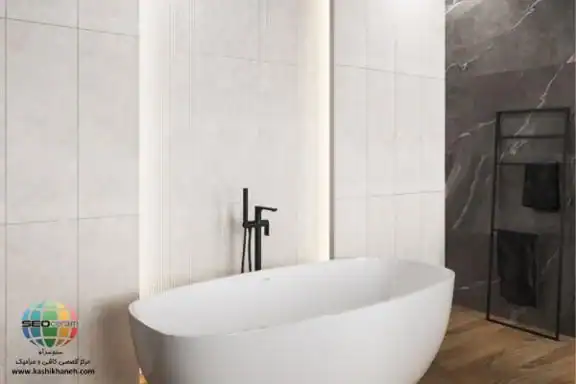 سرامیک کادیس طوسی کاشی پرسپولیس در دنیای معماری مدرن، رنگ طوسی روشن به عنوان یک رنگ خنثی و شیک، حرف اول را میزند. سرامیک کادیس طوسی کاشی پرسپولیس با ابعاد استاندارد 30×90، محصولی از کارخانه پرسپولیس است که با بهرهگیری از تکنولوژی خاکسفید تولید شده است. این محصول با لعاب مات و سطح باکیفیت خود، فضایی مینیمال، دلباز و در عین حال بسیار مقاوم را در خانه شما خلق میکند سایز 30×90 سرامیک کادیس طوسی کاشی پرسپولیس دارای لعاب مات با ضخامت 10 میل یکی از استانداردترین و زیباترین ابعاد برای کاشی بدنه است،بهخصوص که جنس آن خاکسفید (White Body) است که کیفیتی به مراتب بالاتر از کاشیهای معمولی دارد. کادیس طوسی کاشی پرسپولیس،به دلیل تنوع دو طرح ساده و دکوراتیو در کنار هم یکی از بهترین گزینه های برای اجرای کلاسیک دیوار حمام، سرویس بهداشتی،مستر و آشپزخانه هایی با طراحی کلاسیک و نئوکلاسیک،همچنین مناسب برای اجرا در دیوارهای دکوراتیو می باشد. برای خرید این محصول با قیمت بسیار عالی با واحد فروش بازرگانی کاشی و سرامیک سئوسرام (نمایندگی کاشی پرسپولیس در اصفهان) 09138822264 تماس حاصل نمایید.
