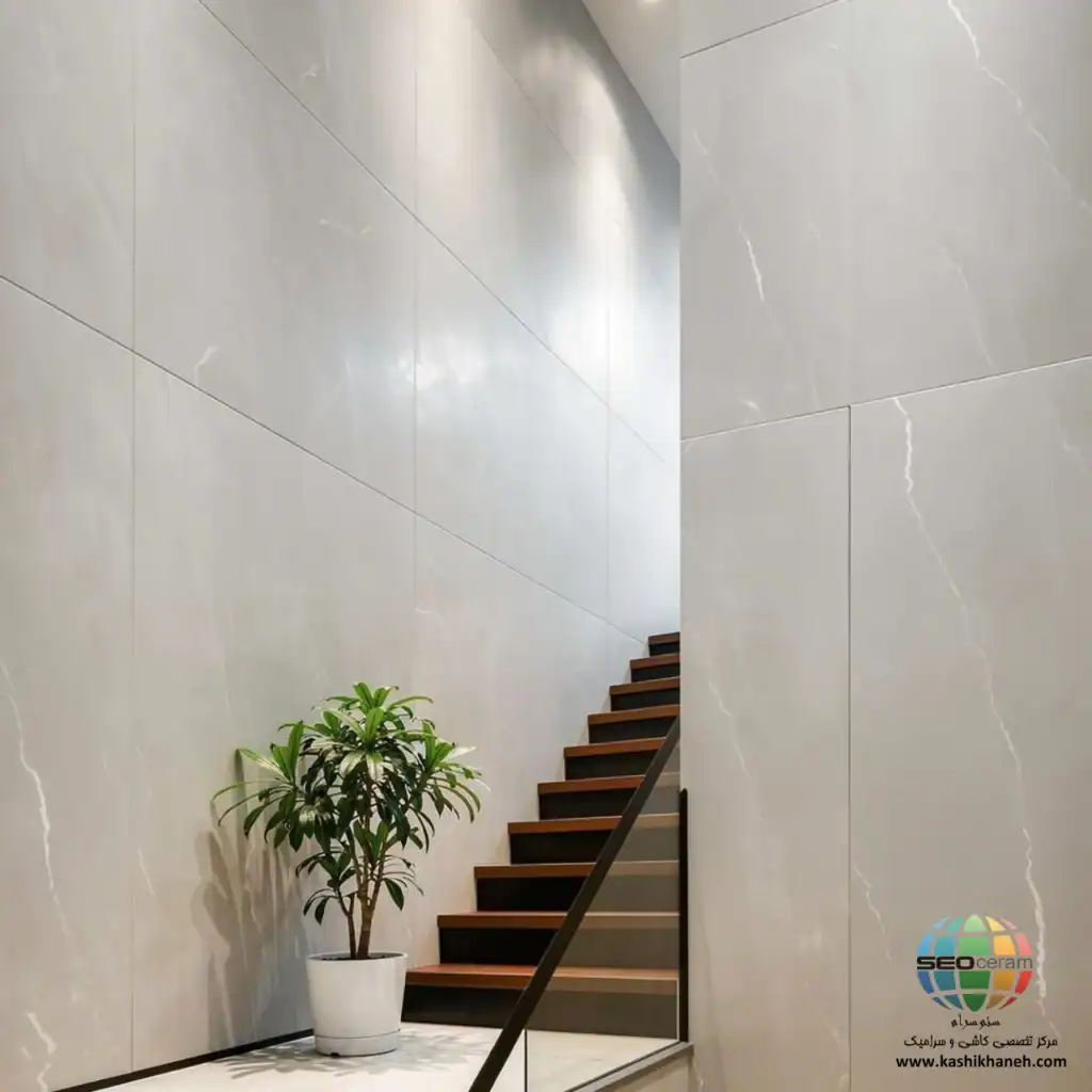 سرامیک S601206088 کاشی برج اردکان - 120×60 سرامیک S601206088 کاشی برج اردکان سایز 60×120 یکی از محصولات باکیفیت و پرکاربرد کارخانه کاشی برج است که با جنس خاک سفید مقاوم و لعاب ترانس (براق)، گزینه‌ای ایده‌آل برای فضاهای داخلی مدرن محسوب می‌شود. سرامیک S601206088 کاشی برج با ابعاد بزرگ خود، جلوه‌ای یکدست و منظم به دیوارها می‌بخشد و با کاهش بندکشی، نمایی لوکس و حرفه‌ای ایجاد می‌کند. رنگ طوسی روشن با رگه های باریک سفید سرامیک S601206088 کاشی برج اردکان باعث شده تا این سرامیک گزینه ی مناسب برای اجرا در فضاهایی که نیازمند رنگ و طراحی خنثی است، می باشد. انعکاس مناسب نور روی سطح براق سرامیک S601206066 کاشی برج به روشن‌ تر شدن محیط کمک کرده و فضاهایی مانند پارکینگ، راه‌پله،حمام و سرویس بهداشتی را بزرگ‌تر و تمیزتر نشان می‌دهد.همچنین مناسب برای اجرا در بدنه انواع فضاهای تجاری و حتی هتل و رستوران ها می باشد. ترکیب کیفیت ساخت بالا، لعاب براق بادوام و بدنه مستحکم خاک سفید، سرامیک S601206088 کاشی برج اردکان را به انتخابی مطمئن برای طراحان داخلی و مجریان ساختمانی تبدیل کرده است. انتخابی که هم از نظر زیبایی بصری و هم از نظر دوام و ماندگاری، استانداردهای بالای پروژه‌های حرفه‌ای را پوشش می‌دهد. برای خرید این محصول با قیمت بسیار عالی با واحد فروش بازرگانی کاشی و سرامیک سئوسرام (نمایندگی کاشی برج در اصفهان) 09138822264 تماس حاصل نمایید.