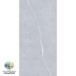 سرامیک S601206088 کاشی برج اردکان - 120×60 سرامیک S601206088 کاشی برج اردکان سایز 60×120 یکی از محصولات باکیفیت و پرکاربرد کارخانه کاشی برج است که با جنس خاک سفید مقاوم و لعاب ترانس (براق)، گزینهای ایدهآل برای فضاهای داخلی مدرن محسوب میشود. سرامیک S601206088 کاشی برج با ابعاد بزرگ خود، جلوهای یکدست و منظم به دیوارها میبخشد و با کاهش بندکشی، نمایی لوکس و حرفهای ایجاد میکند. رنگ طوسی روشن با رگه های باریک سفید سرامیک S601206088 کاشی برج اردکان باعث شده تا این سرامیک گزینه ی مناسب برای اجرا در فضاهایی که نیازمند رنگ و طراحی خنثی است، می باشد. انعکاس مناسب نور روی سطح براق سرامیک S601206066 کاشی برج به روشن تر شدن محیط کمک کرده و فضاهایی مانند پارکینگ، راهپله،حمام و سرویس بهداشتی را بزرگتر و تمیزتر نشان میدهد.همچنین مناسب برای اجرا در بدنه انواع فضاهای تجاری و حتی هتل و رستوران ها می باشد. ترکیب کیفیت ساخت بالا، لعاب براق بادوام و بدنه مستحکم خاک سفید، سرامیک S601206066 کاشی برج اردکان را به انتخابی مطمئن برای طراحان داخلی و مجریان ساختمانی تبدیل کرده است. انتخابی که هم از نظر زیبایی بصری و هم از نظر دوام و ماندگاری، استانداردهای بالای پروژههای حرفهای را پوشش میدهد. برای خرید این محصول با قیمت بسیار عالی با واحد فروش بازرگانی کاشی و سرامیک سئوسرام (نمایندگی کاشی برج در اصفهان) 09138822264 تماس حاصل نمایید.