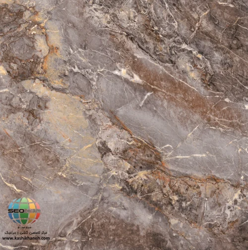 سرامیک فلورین براق کاشی آسیا 60×60 انتخاب سرامیک مناسب یکی از مهم‌ترین مراحل در طراحی داخلی ساختمان است. متریالی که برای کف یا دیوار انتخاب می‌شود، علاوه بر تأثیر مستقیم بر زیبایی فضا، در دوام، نگهداری و ارزش نهایی محیط نیز نقش مهمی دارد. در میان محصولات جدید بازار، سرامیک فلورین براق کاشی آسیا به دلیل طراحی خاص و ظاهر لوکس خود توانسته توجه بسیاری از طراحان داخلی، معماران و خریداران را به خود جلب کند. با مشاهده سرامیک فلورین براق کاشی آسیا، به‌وضوح می‌توان الهام‌گیری آن از سنگ‌های مرمر طبیعی را مشاهده کرد. زمینه‌ای از رنگ‌های قهوه‌ای، خاکستری و کرم در کنار رگه‌های روشن و طلایی، جلوه‌ای مشابه سنگ‌های گران‌قیمت طبیعی ایجاد کرده است. این ویژگی باعث شده سرامیک فلورین براق کاشی آسیا انتخابی ایده‌آل برای فضاهای لوکس و مدرن باشد. ابعاد 60×60 سانتی‌متری این محصول نیز امکان اجرای منظم و یکپارچه را فراهم می‌کند و موجب کاهش خطوط بندکشی در سطح می‌شود. نتیجه نهایی، فضایی وسیع‌تر، منظم‌تر و چشم‌نوازتر خواهد بود.